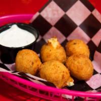 Slash Balls · Diced jalapeno, cheddar, and cream cheese rolled in panko, fried, and served with ranch.