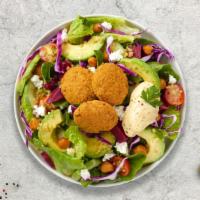 Feelin' Falafel Gyro Salad · Crispy falafel balls mixed with salad base and made to perfection.