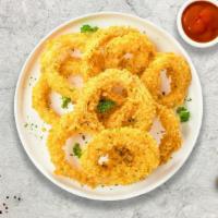 Crispy Onion Rings · Golden crispy onions battered and fried.