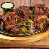 Goden Tibs · beef ribs fried & cooked to perfection.