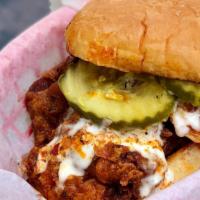 Nashville Chicken Sandwich  · Nashville spice fried chicken, ranch dressing, pickle, potato roll.