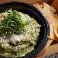 Guacamole And Chips · Fresh house made guacamole topped with cotija cheese and cilantro, and a side of corn tortil...