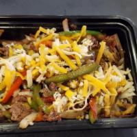 Steak Fajitas · Sliced flank steak, grilled green peppers, red bell peppers and onions, soft corn tortillas,...