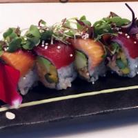 Chikara King Roll · King crab, asparagus, avocado, topped with fresh tuna and salmon, finished with balsamic vin...