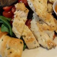 Portabella Salad · Grilled chicken breast and portabella mushrooms, served on a bed of spring mix with olives, ...