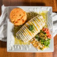 Burrito Ranchero · With beans, cheese, steak, tomato, onion, and jalapeño, covered in green sauce and melted ch...
