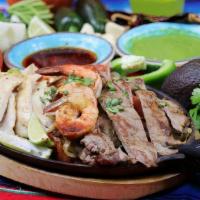 Fajitas Mixtas · Seasoned and grilled chicken, steak, and shrimp cooked with bell pepper, onion and tomato. S...