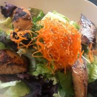 Grilled Sesame Salmon Salad · Green salad with grilled sesame salmon on top