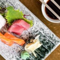 Assorted Sashimi Appetizer · Fresh raw fish served with shredded radish