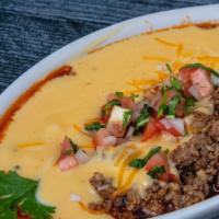 Queso Fundido · Warm queso with fresh house chorizo and pico de gallo, served with tortilla chips.