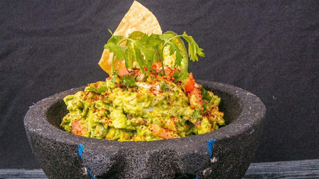 Guacamole Bowl · Made to order guacamole served with house corn tortilla chips .