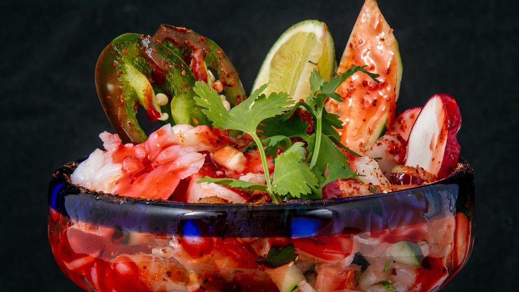 Ceviche · Shrimp cured in lime juice, cucumber radish pico de gallo served with tortilla chips.