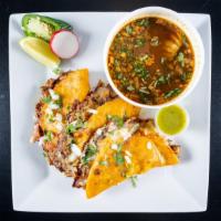 Birria Tacos (3) · Marinated slow cooked beef short rib, ribeye in spiced adobo broth, tucked in grilled adobo ...