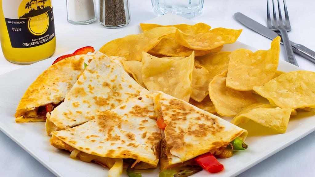 Quesadilla · Choice of sirloin steak, chicken, veggie, chorizo, chicharron or shrimp for an additional cost. Flour tortilla grilled with peppers and onions, cheddar Jack and served with a side of sour cream and guacamole. Choice of rice, fries or chips.