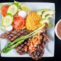 Carne Asada Dinner · Grilled sirloin steak, sliced thin, served with Mexican rice, refried beans, pico de gallo, ...