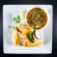 Birria Burrito · Large 12' flour tortilla filled with our famous marinated. Slow cooked short rib and ribeye ...