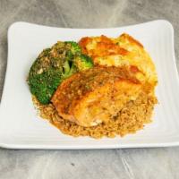 Stuffed Salmon With Two Sides  · Grilled salmon stuffed with crab and shrimp. Served over a bed of seasoned rice and your cho...