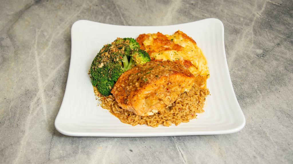 Stuffed Salmon With Two Sides  · Grilled salmon stuffed with crab and shrimp. Served over a bed of seasoned rice and your choice of two sides.