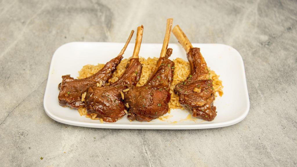 Lamb Chops (4) With 2 Sides · Served on a bed of seasoned rice.