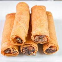 
Thai Rolls  · Crispy spring rolls filled with homemade filling (chicken, bean thread, carrots, cabbage, an...