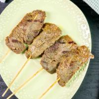 Satay (4) · Grilled skewers of beef or chicken marinated in Thai herbs and coconut milk. Served with hom...