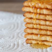 Honey Butter Biscuits · Famous butter biscuits pastry brushed in honey.