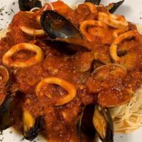 Seafood Pescatore · Pasta with clams, mussels, calamari, and shrimp in a marinara sauce.