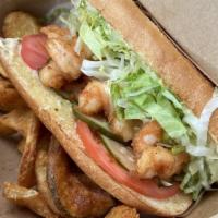 Po'Boy · Choice of fried shrimp or grilled salmon on a baguette with remoulade, lettuce, tomato, and ...