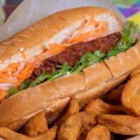 Shrimp Banh Mi · Fried spiced shrimp cake served in a banh mi roll with house-made mayonnaise, pickled shredd...