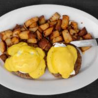 Pork Sausage Benedict · English muffin topped with grilled sausage patties, two poached eggs and hollandaise sauce.