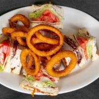 Turkey Club · Turkey, bacon, lettuce tomato mayo and swiss cheese on a three decker sandwich