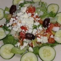 Greek Salad · Lettuce, cucumbers, red onions, feta cheese and Kalamata olives served with our homemade dre...
