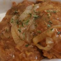 Smothered Pork Chops · 2 jumbo sized pork chops smothered in gravy and onions and served with 2 of our delicious si...