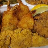 Fried Seafood Platter · 2 golden fried whiting fish with 4 butterflied shrimp and a handmade seafood crab cake fried...