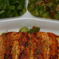Cajun Salmon · Grilled 8oz. Atlantic Salmon perfectly seasoned in our cajun  seasoning and served with 2 de...
