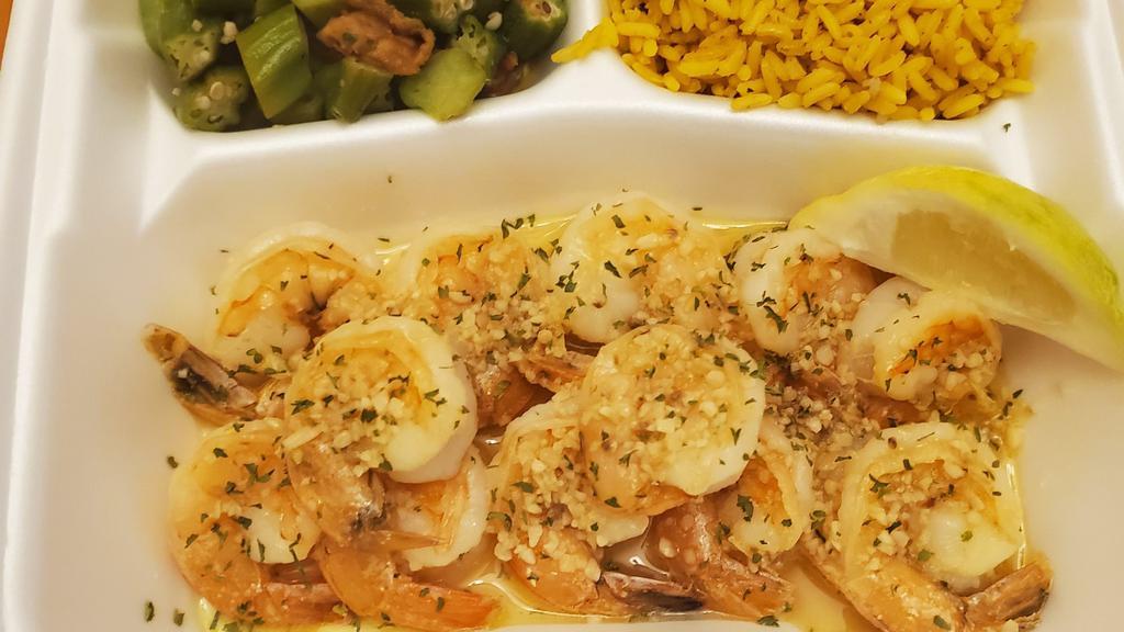 Garlic  Shrimp Over Rice  · A bunch of our  garlic shrimp poured over white rice and served with broccoli.