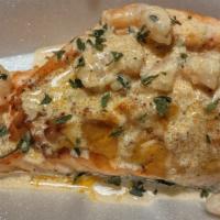 Stuffed  Salmon  · Atlantic Salmon stuffed with crab and deviled crab meat topped with shrimp and drizzled with...
