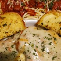 Chicken Parm. And Spaghetti  · 2 pieces of chicken breast breaded and seasoned then fried to perfection. Drenched in tomato...