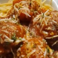 Spaghetti And Meatballs · Our homemade spaghetti sauce and meatballs poured over spaghetti noodles and served with gar...