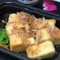 Age Tofu · Silken firm tofu, cut into cubes, is lightly dusted with cornstarch, and then deep fried unt...