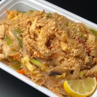 Chicken Pad Thai · Tender rice noodles, juicy chicken, with vegetable. Topped with Crushed peanut.