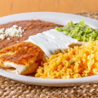 Burrito El Mexicano · With beef and side of rice and beans, Mexican flag over red hot sauce, sour cream, and guaca...