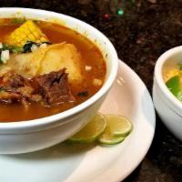 Caldo De Res · Beef soup w/ carrots, potatoes, cabbage & corn