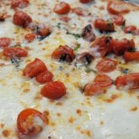 The Classic · Roasted tomato, fresh basil, fresh mozzarella, evoo, cheese blend.