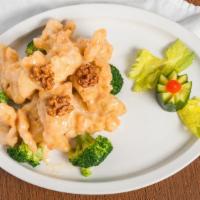 Coconut Chicken · Crispy chicken coated in a special coconut creamy sauce. Served with white rice or brown ric...