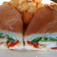 Grilled Chicken · Sliced chicken, fontina cheese, lettuce, tomato, onion, and herb mayonnaise on focaccia bread.
