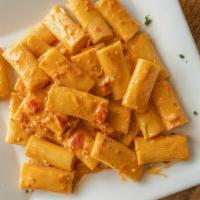 Vodka Rigatoni · Fresh chopped tomatoes and prosciutto, in a creamy vodka sauce. Served with soup or salad an...