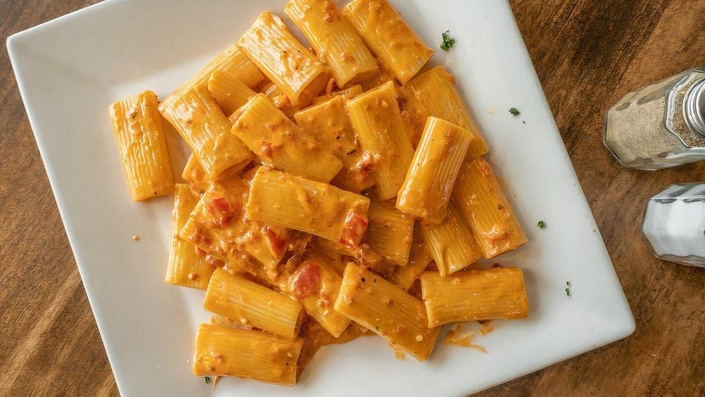 Vodka Rigatoni · Fresh chopped tomatoes and prosciutto, in a creamy vodka sauce. Served with soup or salad and bread.