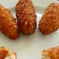 Jalapeño Poppers · Four cream cheese poppers with ranch dipping sauce.