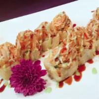 Deep Fried Summer Roll · Cream cheese, avocado, salmon inside, top with spicy crabmeat and scallion with wasabi and e...